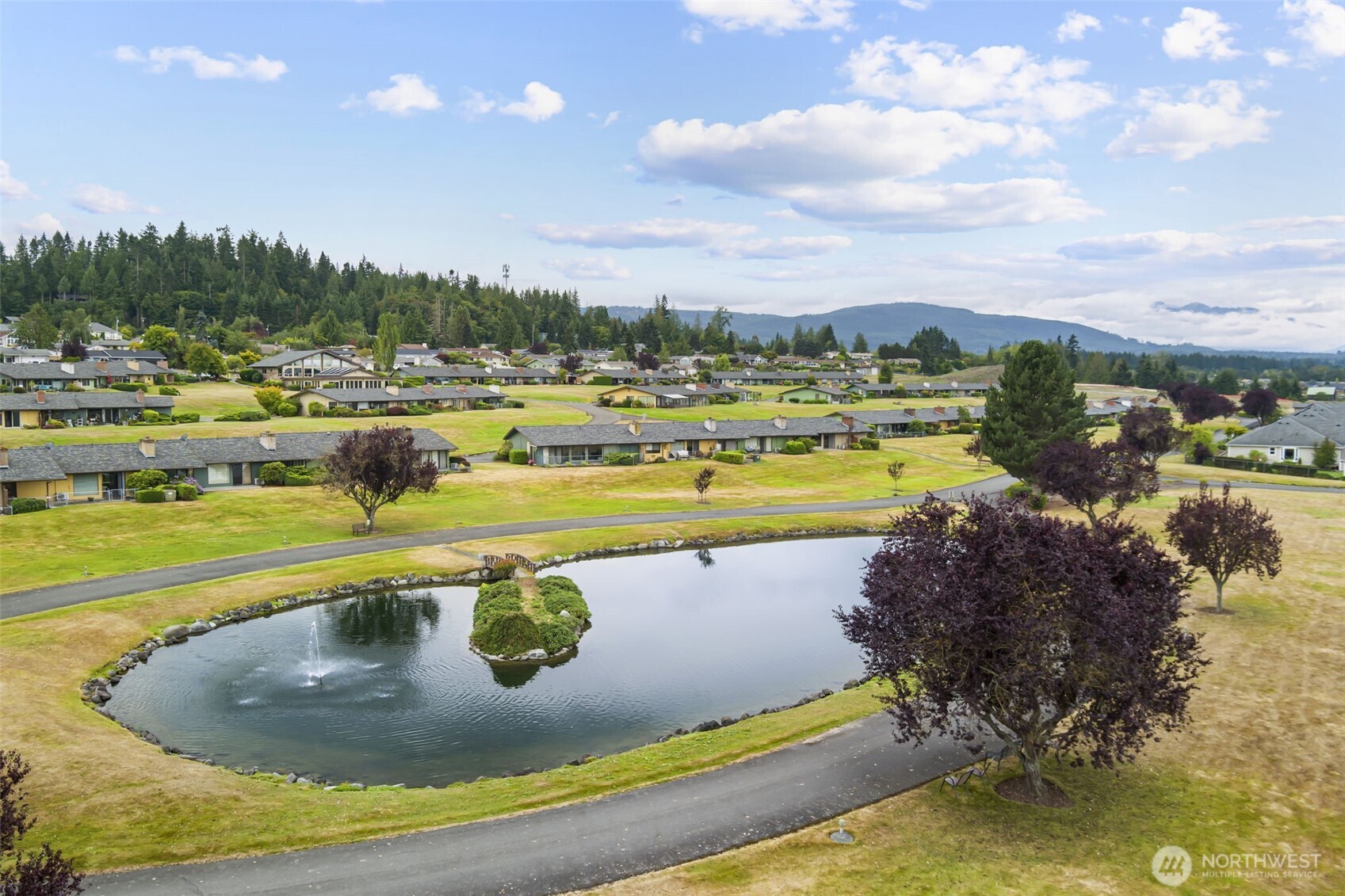 1301 South 3rd Avenue, Unit 15D Sequim, WA 98382 - Photo 20 of 26 a view of a swimming pool and lake