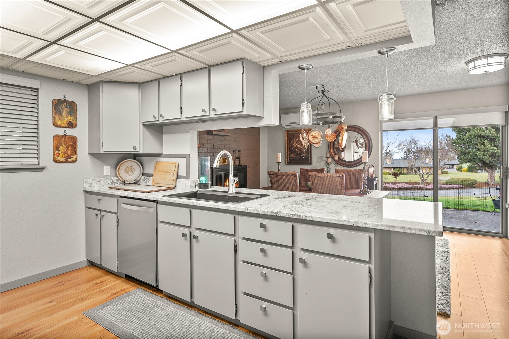 1301 South 3rd Avenue, Unit 15D Sequim, WA 98382 - Photo 3 of 26 a kitchen with granite countertop a sink and cabinets