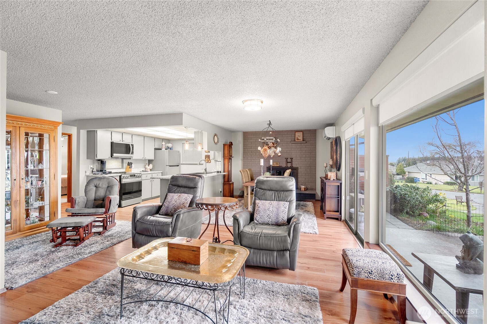 1301 South 3rd Avenue, Unit 15D Sequim, WA 98382 - Photo 7 of 26 a living room with furniture floor to ceiling window and wooden floor
