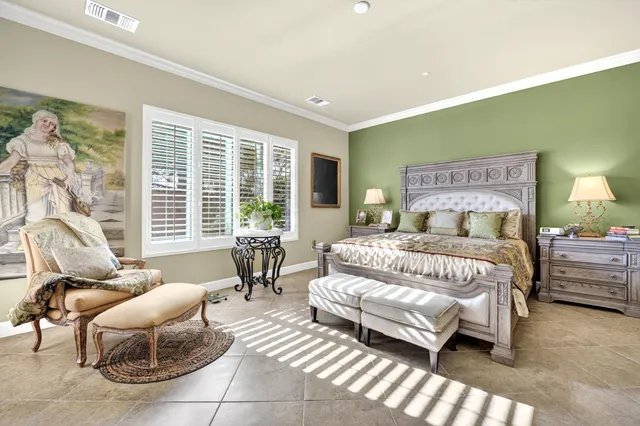 a bedroom with a bed and a table