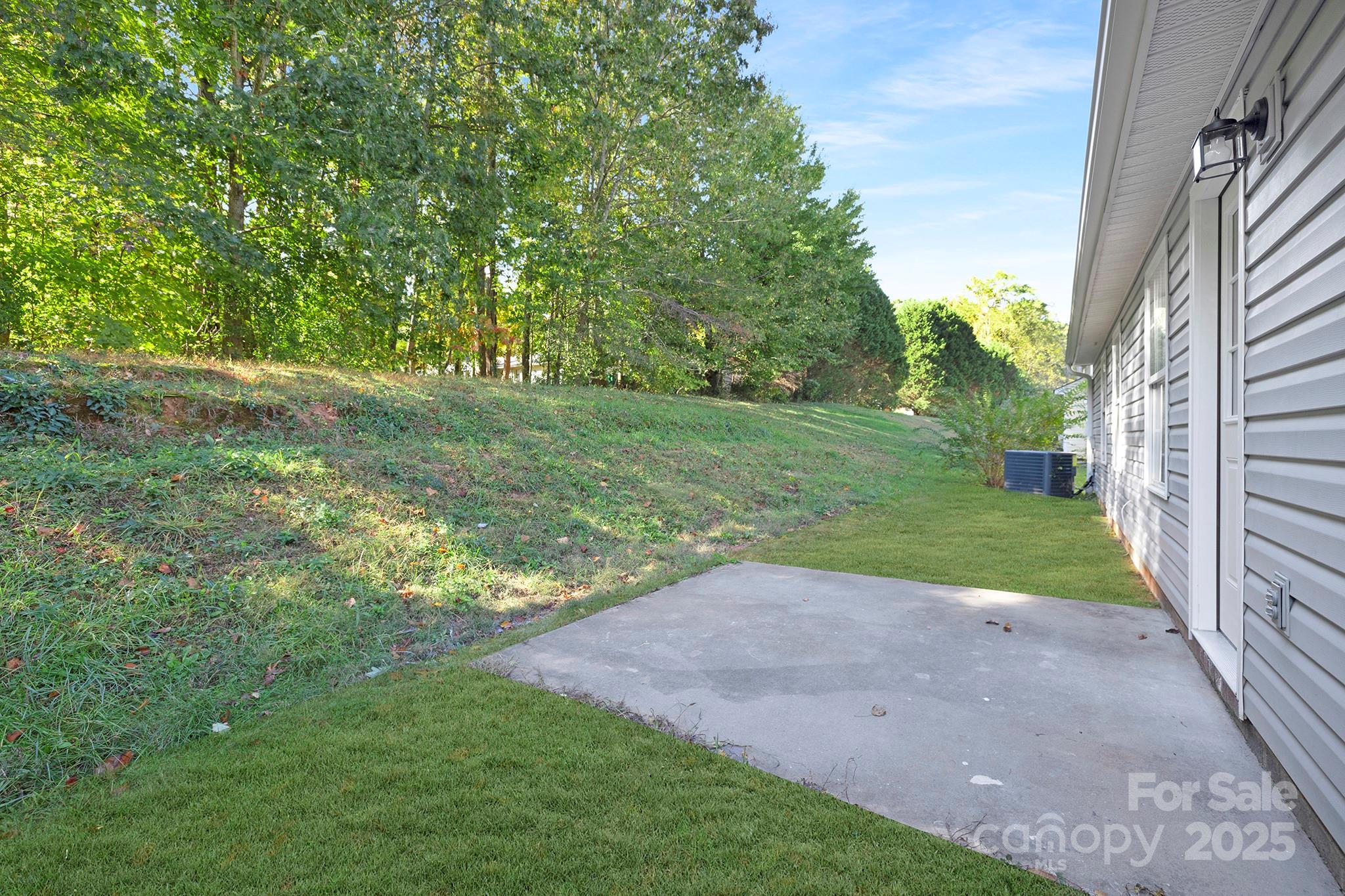 2012 Pheasant Glen Road Charlotte, NC 28214 - Photo 20 of 20 a view of a yard with a tree