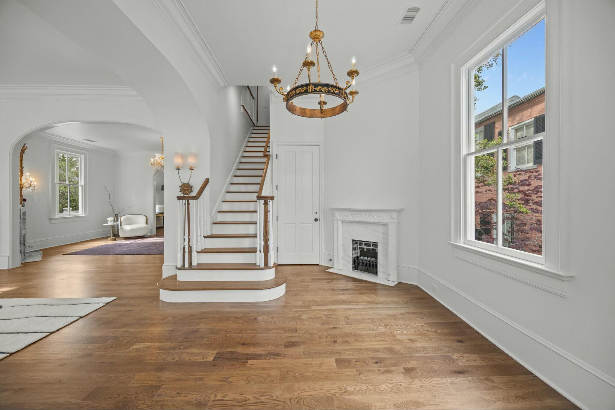 24 Chalmers Street Charleston, SC 29401 - Photo 4 of 58 gracious entrance foyer with fireplace