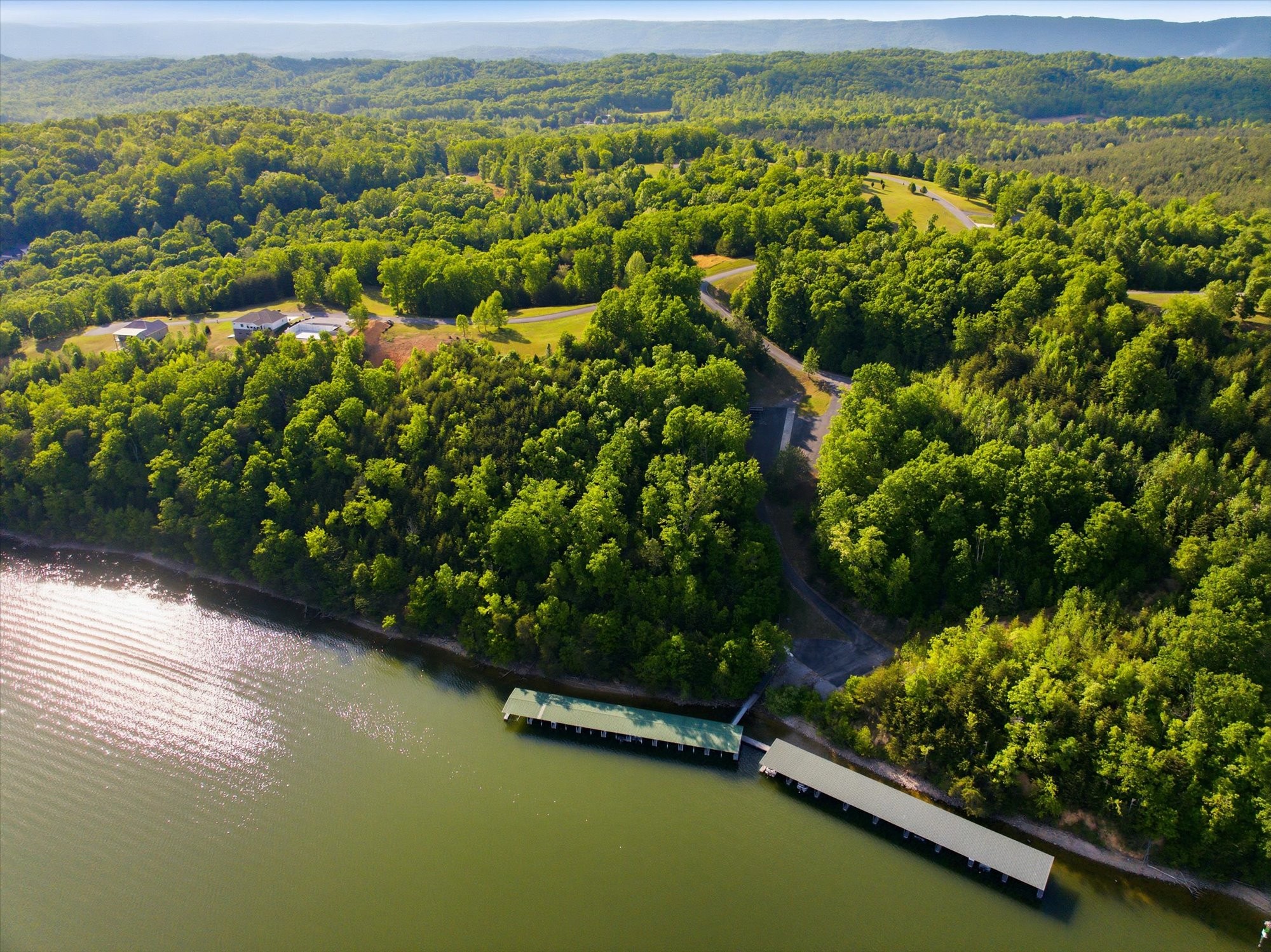 240 River Run Trail Spring City, TN 37381 - Photo 16 of 24 a view of a lake with a mountain view