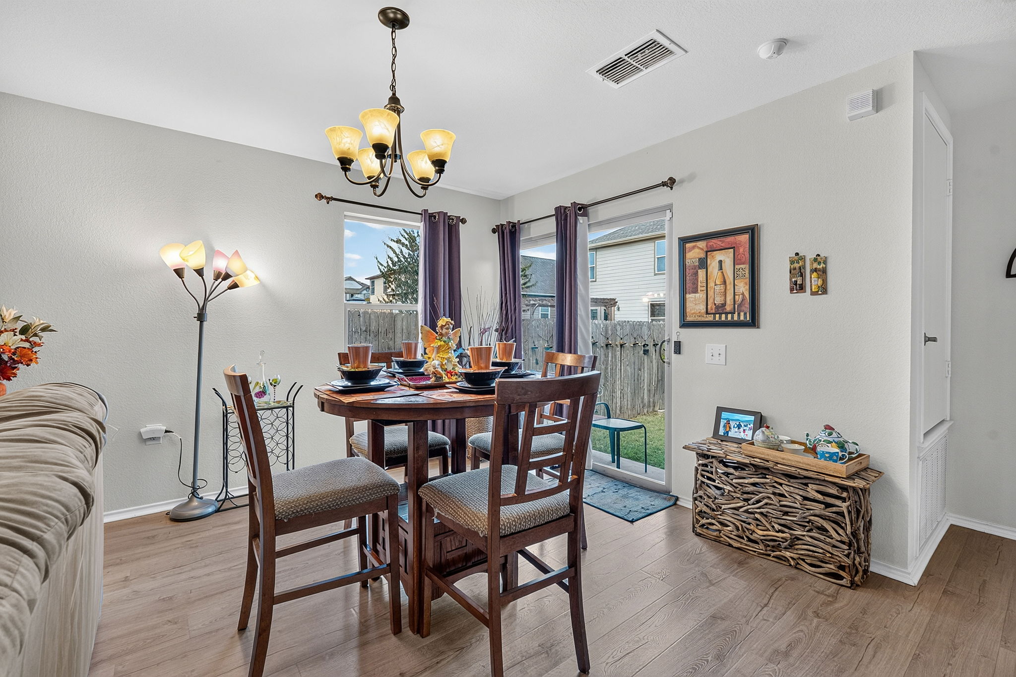 9004 Wiley Way Austin, TX 78747 - Photo 8 of 39 Warm wood flooring and sliding glass doors define this inviting eating area.