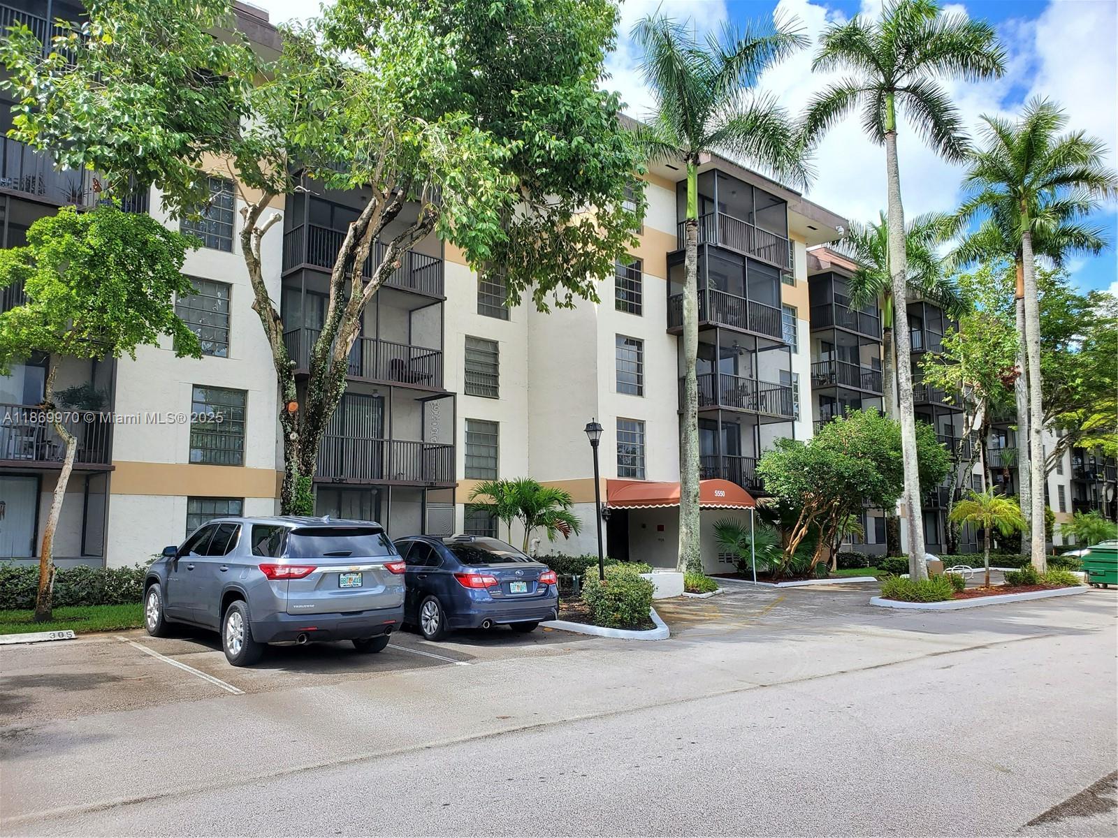 5550 Northwest 44th Street, Unit 111B Lauderhill, FL 33319 - Photo 1 of 22 a car parked in front of a building