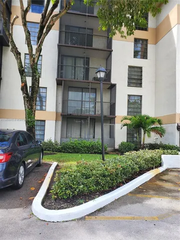 a view of multiple houses with a yard