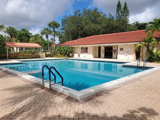 a view of a house with swimming pool