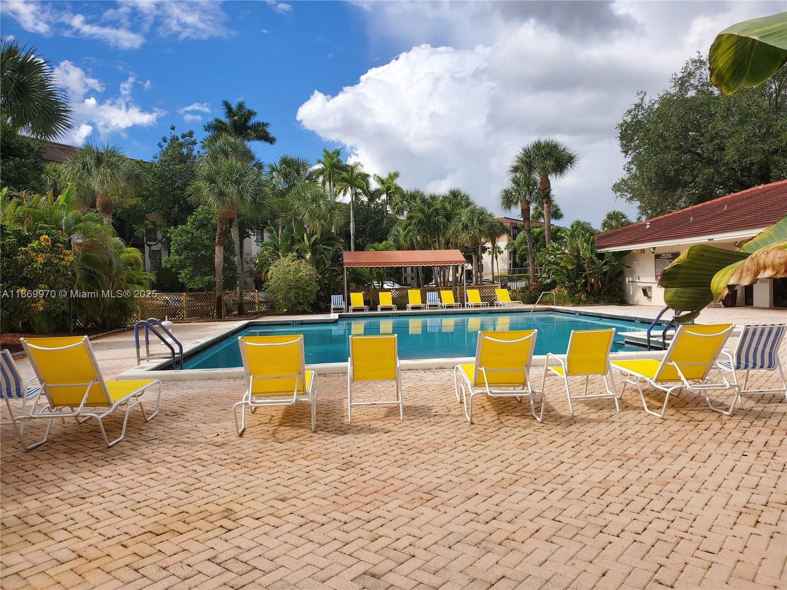 5550 Northwest 44th Street, Unit 111B Lauderhill, FL 33319 - Photo 22 of 22 an outdoor space with pool and furniture