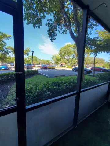 a view of balcony with a yard