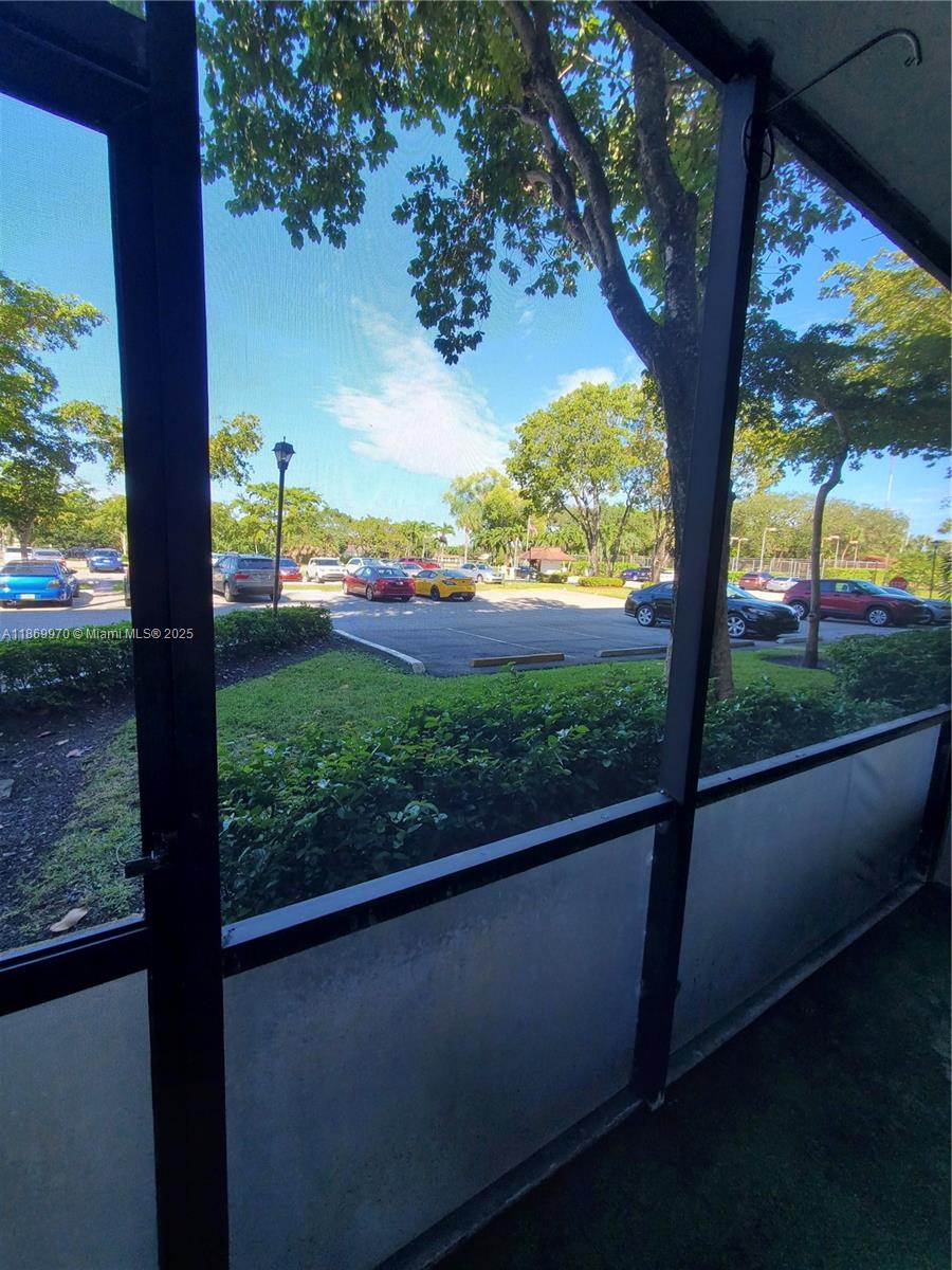 5550 Northwest 44th Street, Unit 111B Lauderhill, FL 33319 - Photo 3 of 22 a view of balcony with a yard