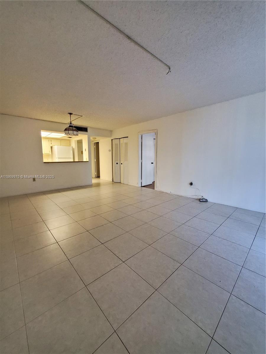 5550 Northwest 44th Street, Unit 111B Lauderhill, FL 33319 - Photo 5 of 22 a view of an empty room with a window