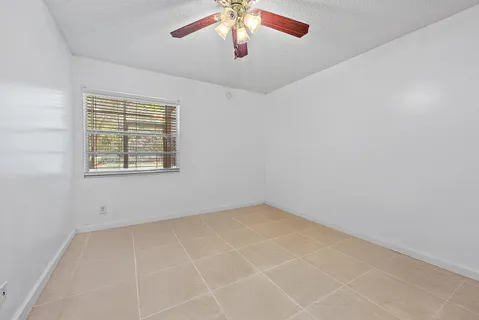 a view of an empty room with a bathroom
