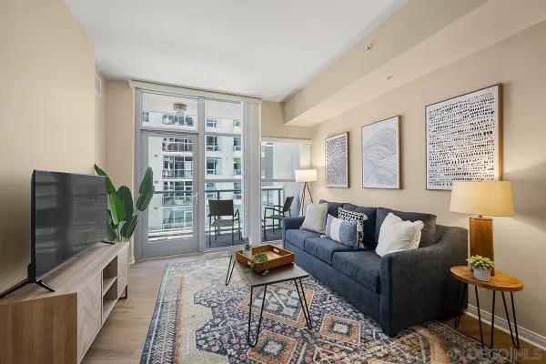 a living room with furniture and a flat screen tv