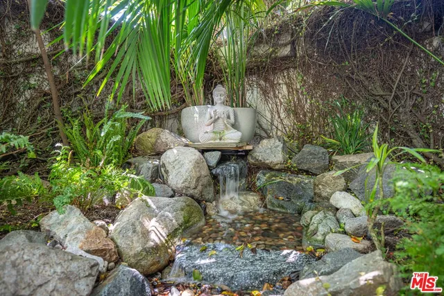 a view of a garden with a tree