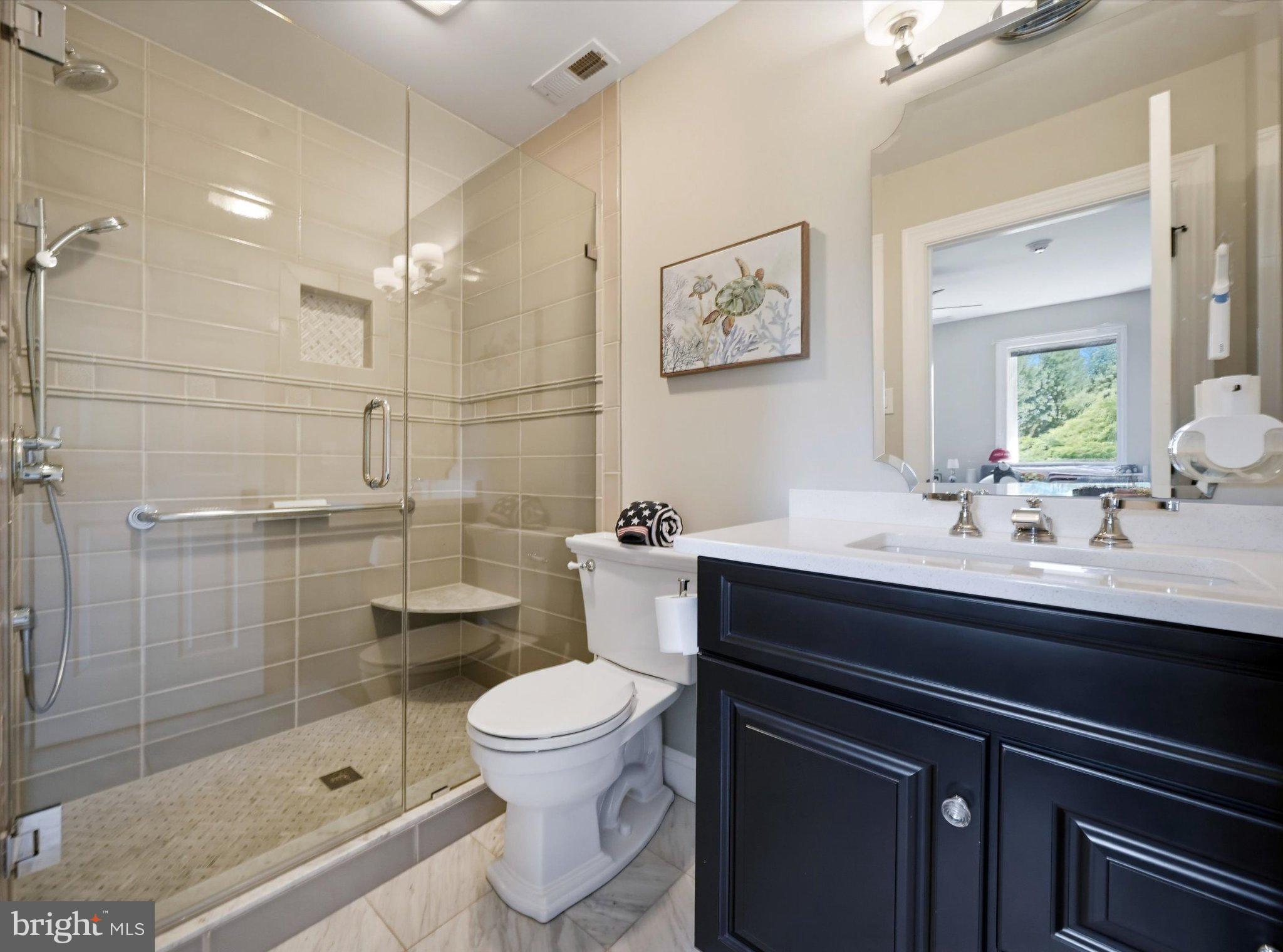 1540 Fairville Road Chadds Ford, PA 19317 - Photo 42 of 84 Modern elegance in a serene bathroom.