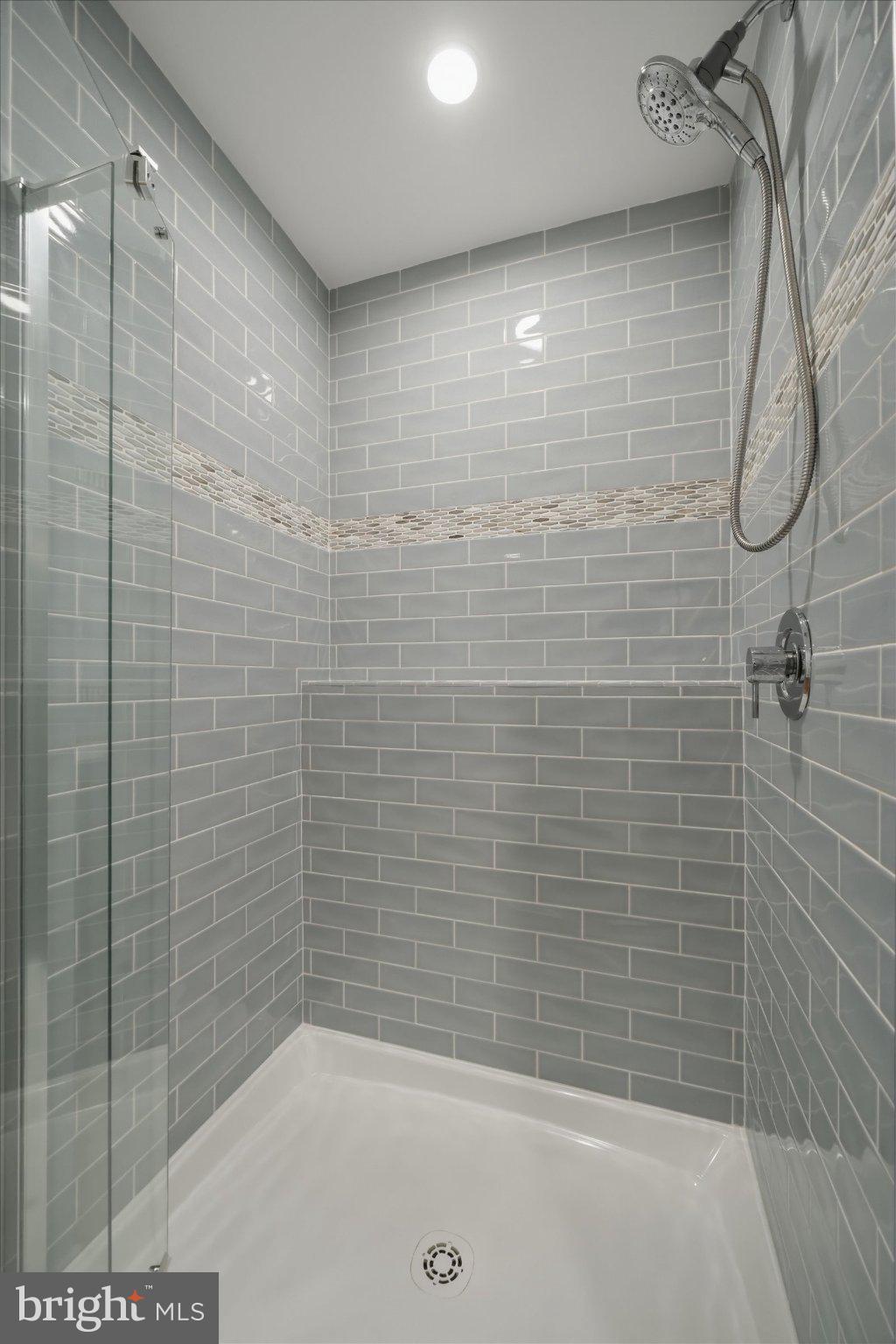 1540 Fairville Road Chadds Ford, PA 19317 - Photo 66 of 84 Sleek modern shower with elegant tiles.