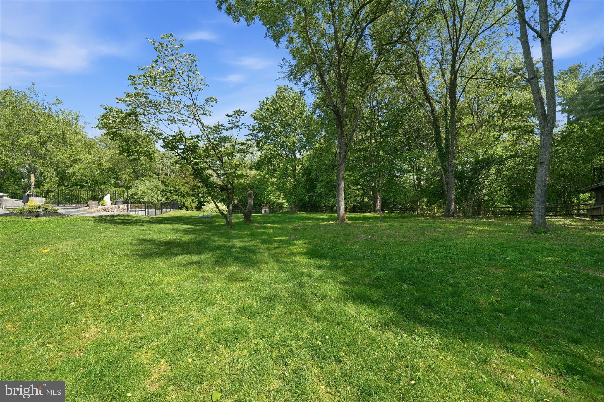 1540 Fairville Road Chadds Ford, PA 19317 - Photo 72 of 84 Lush green oasis under blue skies.