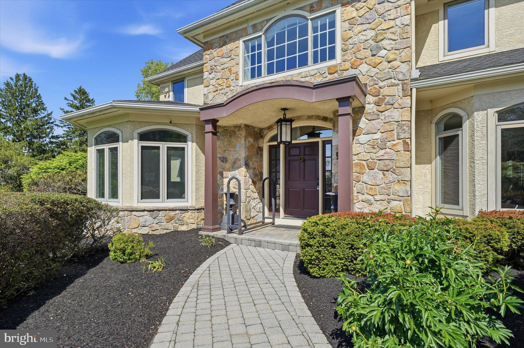 1540 Fairville Road Chadds Ford, PA 19317 - Photo 75 of 84 Elegant stone entrance with lush greenery.