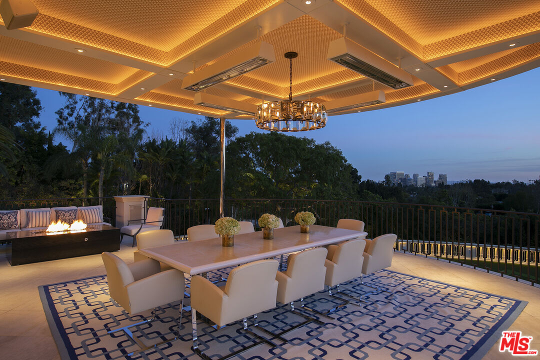 Undisclosed Address Beverly Hills, CA 90210 - Photo 14 of 14 a view of a patio with a table and chairs