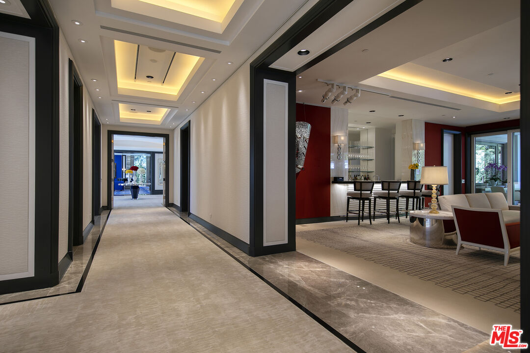 Undisclosed Address Beverly Hills, CA 90210 - Photo 4 of 14 a view of a hallway with dining area and livingroom view