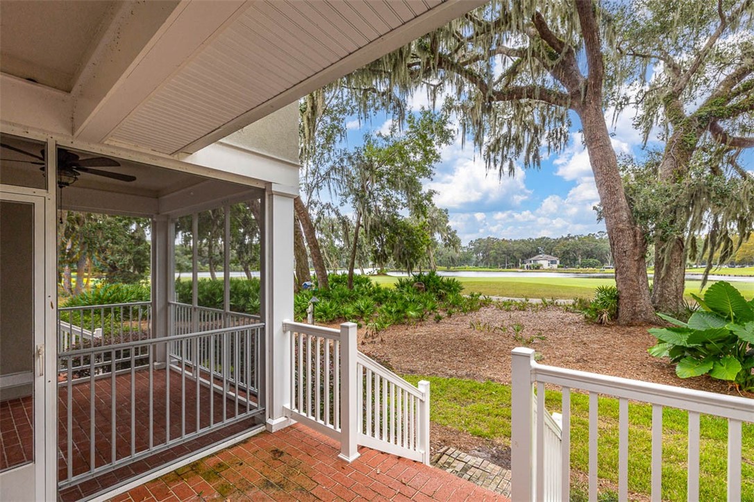 119 Kiln Trail St. Simons Island, GA 31522 - Photo 9 of 23 Covered Brick Patio, Screen Porch and Lake