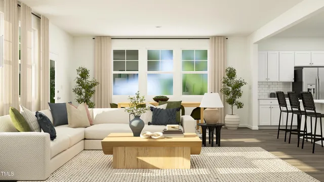 a living room with furniture potted plant and a window