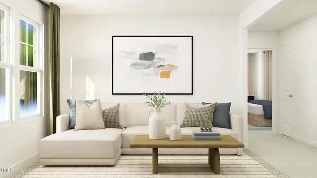 a living room with furniture and a painting