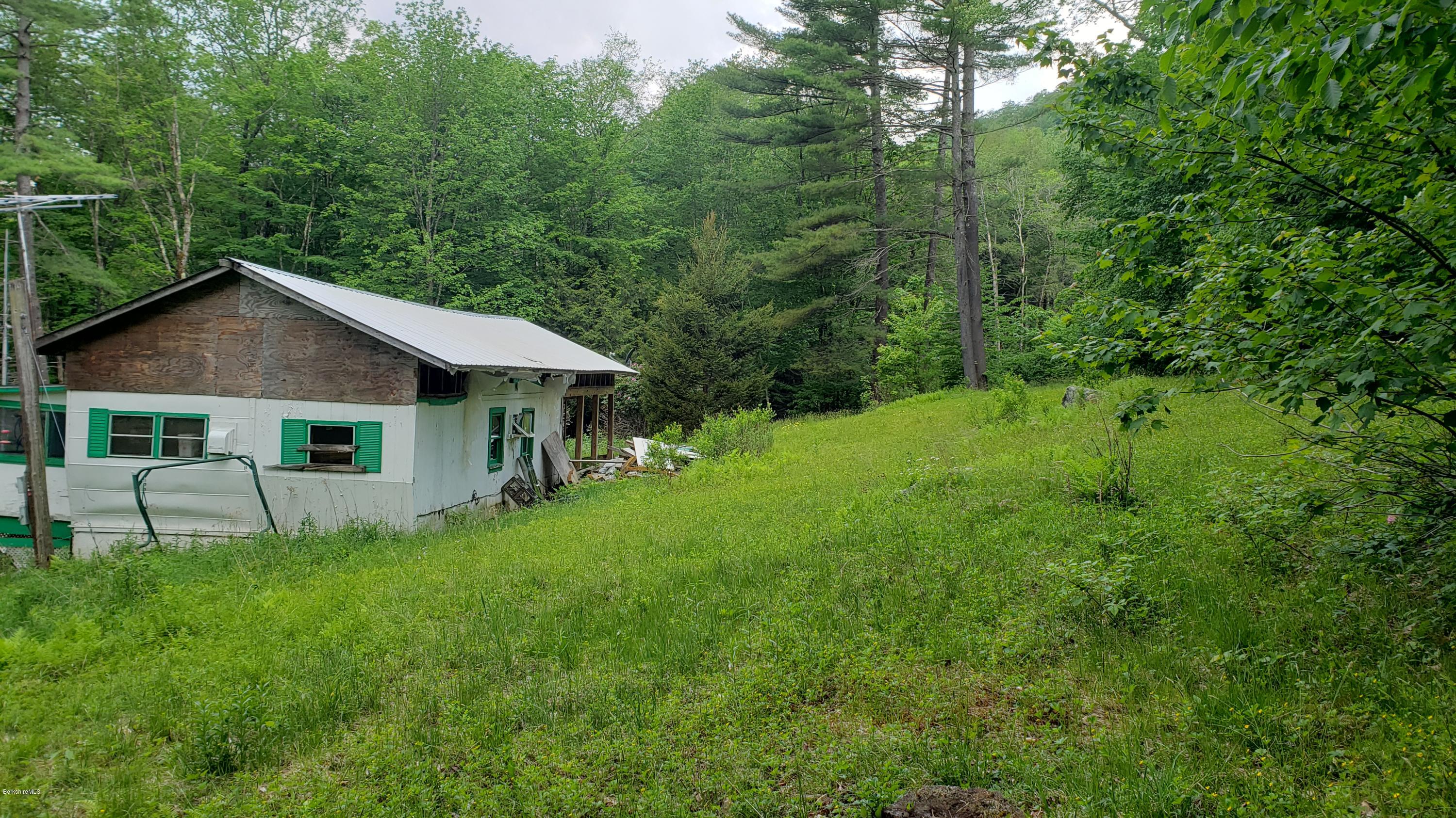 805 Lincoln Road Stamford, VT 05352 - Photo 2 of 13 a view of a house with a yard