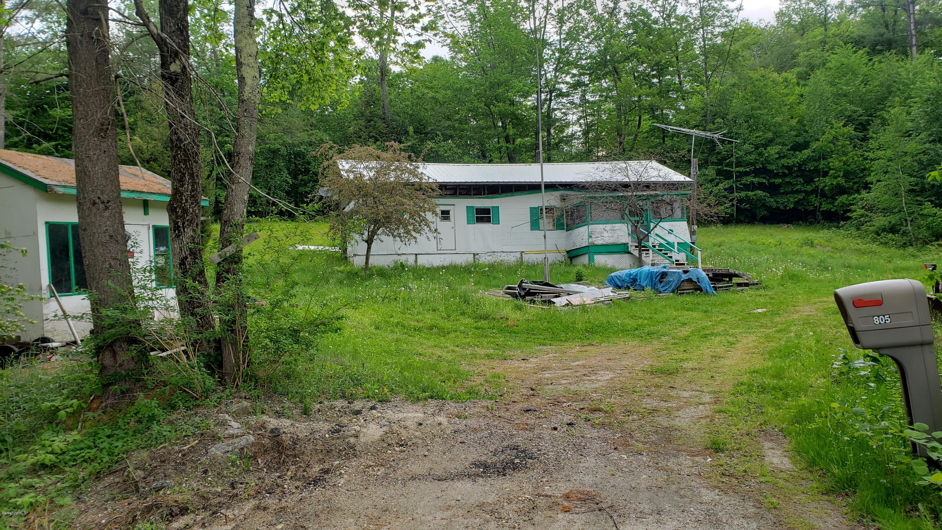 805 Lincoln Road Stamford, VT 05352 - Photo 10 of 13 a front view of a house with garden