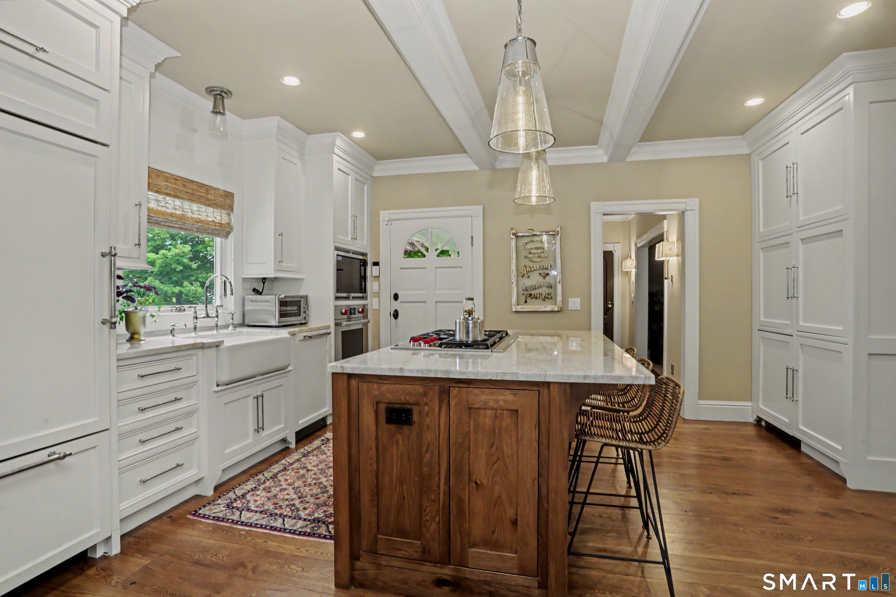 36 Catoonah Street, Unit 18 Ridgefield, CT 06877 - Photo 13 of 40 a kitchen with stainless steel appliances kitchen island granite countertop a sink a stove a refrigerator and cabinets