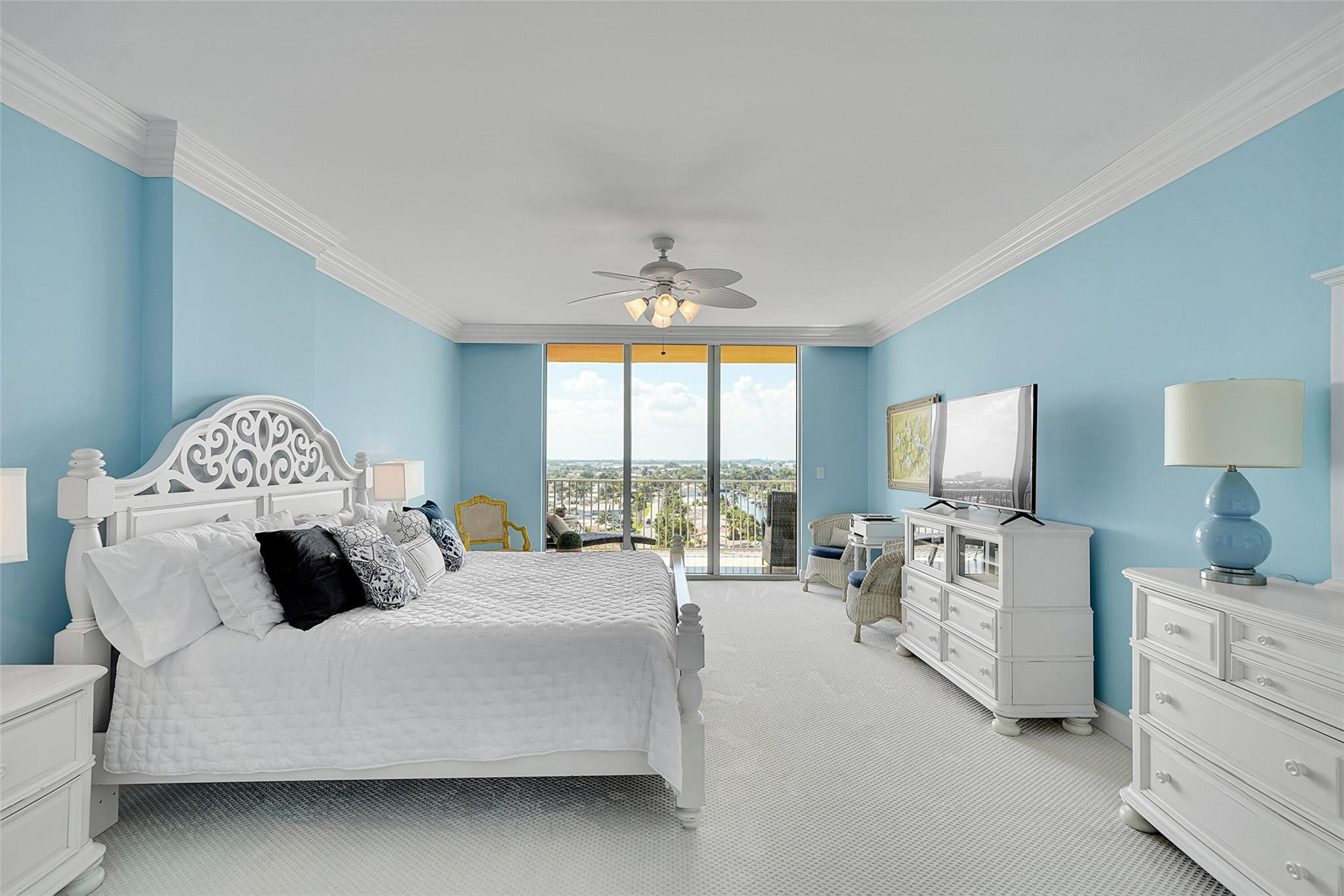 821 North Riverside Drive, Unit PH2 Pompano Beach, FL 33062 - Photo 41 of 95 a bedroom with bed a large bed and a large window