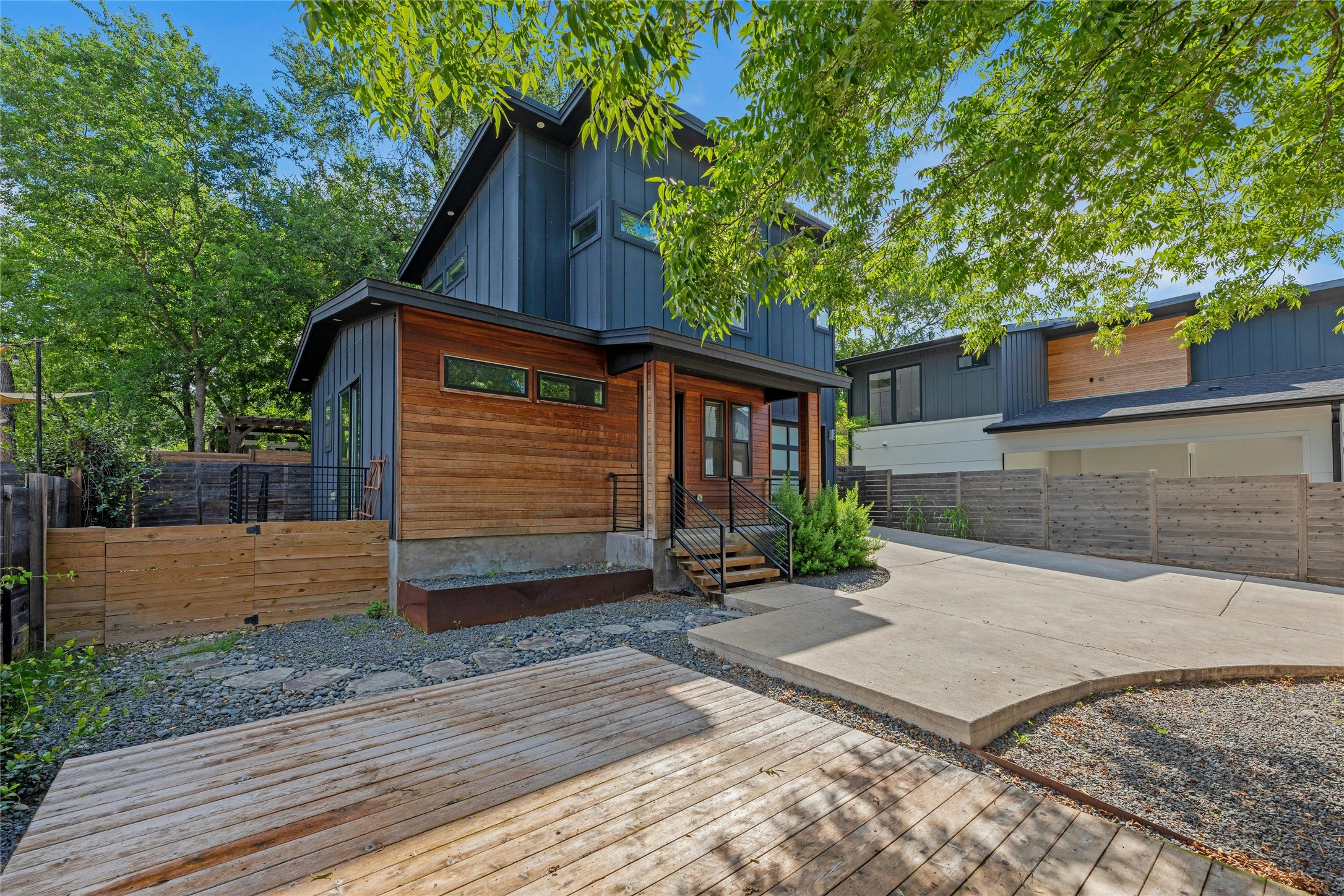 4606 Ledesma Road, Unit 2 Austin, TX 78721 - Photo 29 of 33 A striking contemporary home with a blend of wood siding and vertical paneling, offering a private driveway.