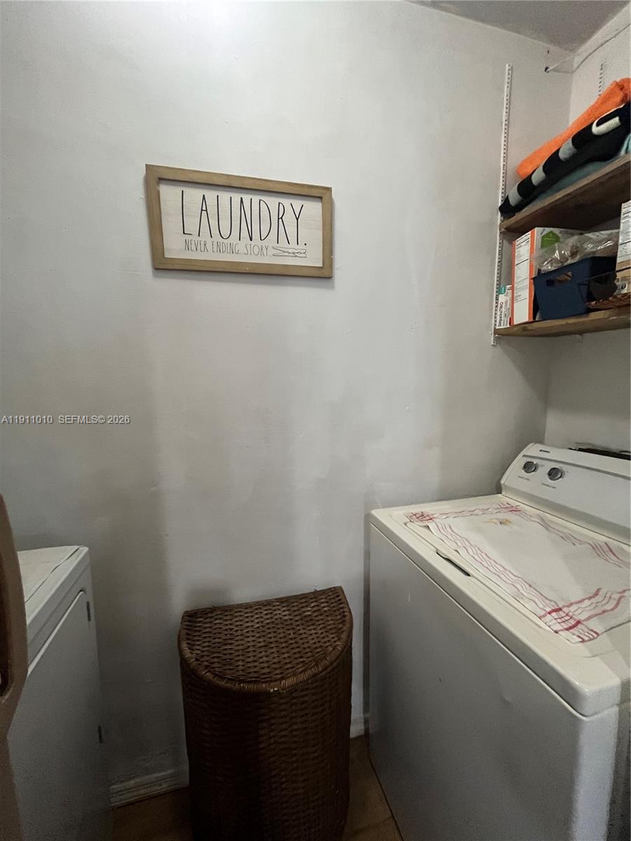 12215 Southwest 119th Terrace Miami, FL 33186 - Photo 7 of 17 a utility room with dryer and washer