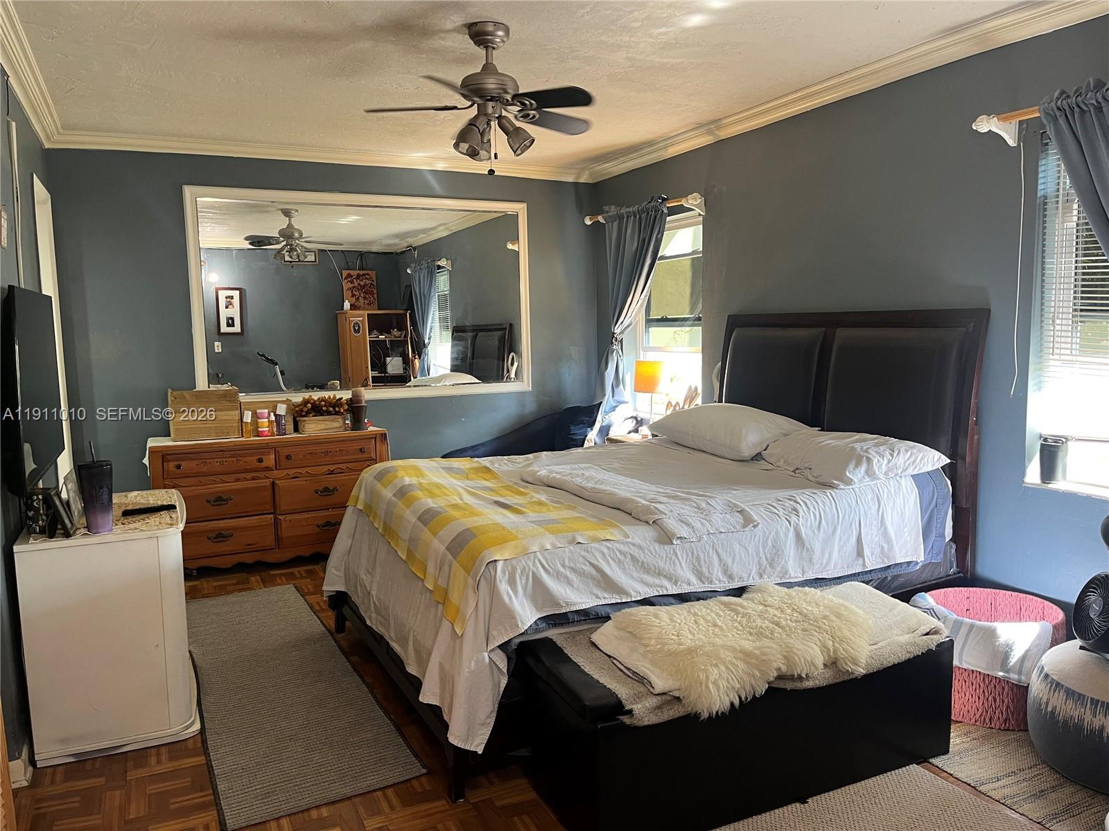 12215 Southwest 119th Terrace Miami, FL 33186 - Photo 8 of 17 a bedroom with a bed couch and window