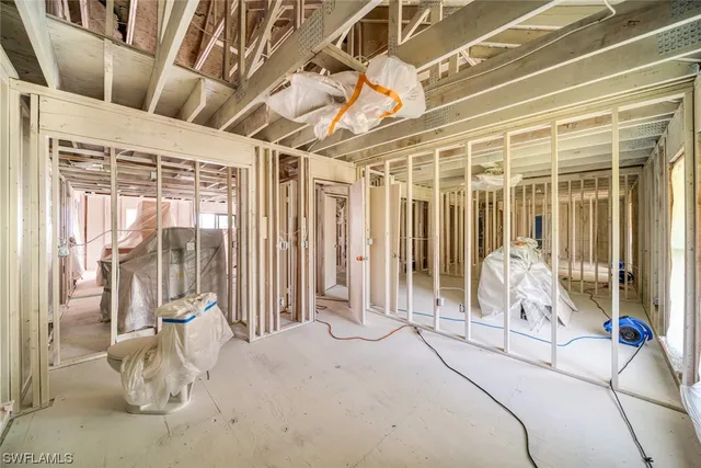 a view of a hallway with wooden floors