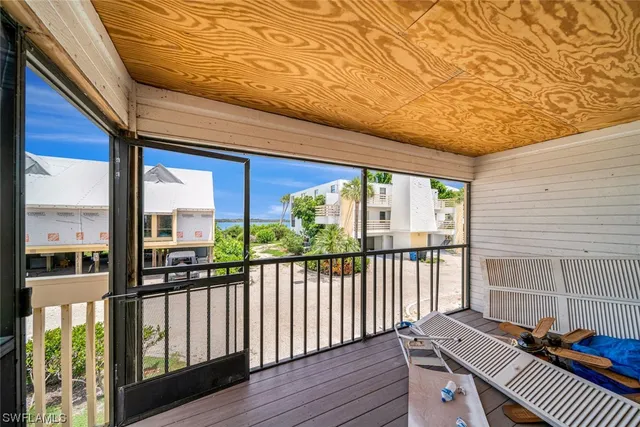 a view of a swimming pool with an outdoor seating