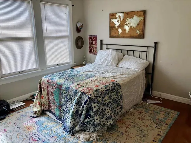 a bathroom with a sink a mirror and a shower