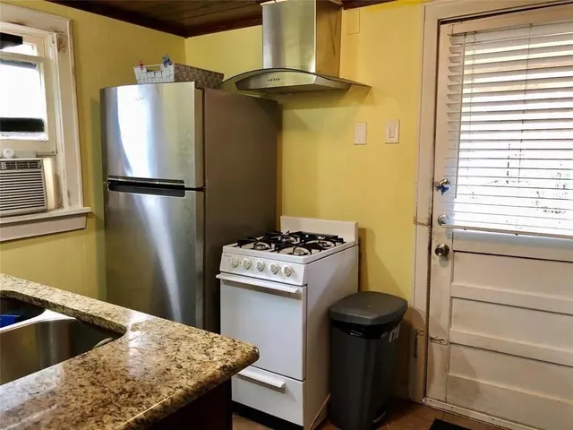 a bedroom with a bed and a table in it