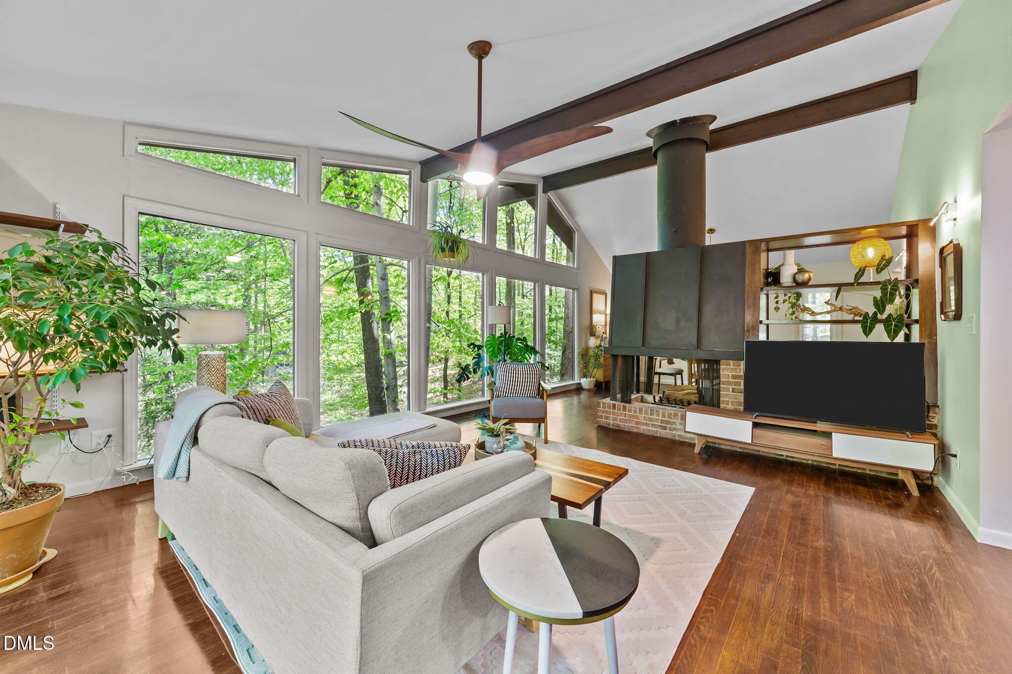 105 Barcliff Terrace Cary, NC 27518 - Photo 12 of 47 a living room with patio furniture and a floor to ceiling window