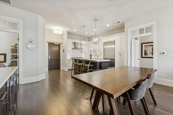 a view of a dining room with furniture and wooden floor