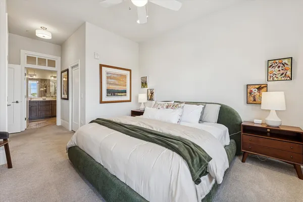 a bedroom with bed and window