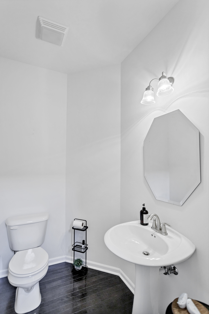 2967 Madison Drive Naperville, IL 60564 - Photo 11 of 24 a bathroom with a sink and a mirror