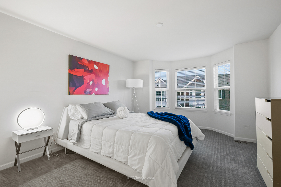 2967 Madison Drive Naperville, IL 60564 - Photo 12 of 24 a bedroom with a bed and a painting on the wall