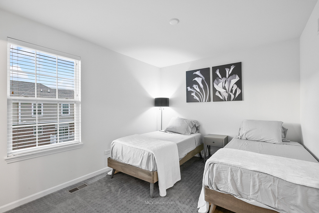 2967 Madison Drive Naperville, IL 60564 - Photo 15 of 24 a bedroom with two beds and a window