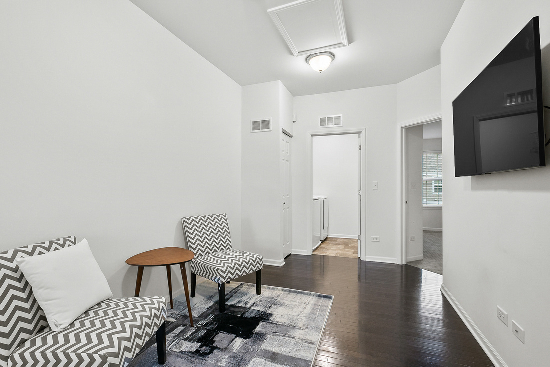 2967 Madison Drive Naperville, IL 60564 - Photo 17 of 24 a living room with furniture and a wooden floor