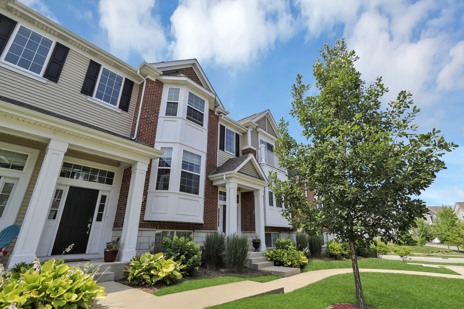 2967 Madison Drive Naperville, IL 60564 - Photo 3 of 24 a front view of a multi story residential apartment buildings