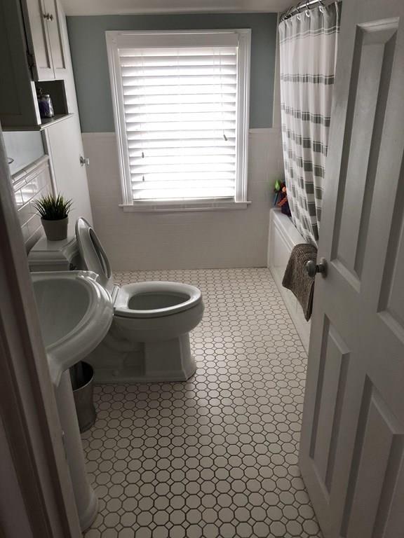 16 Mayfield Street Springfield, MA 01108 - Photo 11 of 20 a bathroom with a sink toilet and window