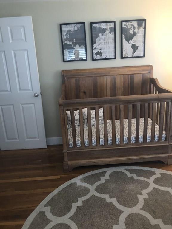 16 Mayfield Street Springfield, MA 01108 - Photo 13 of 20 a bedroom with a bed and furniture