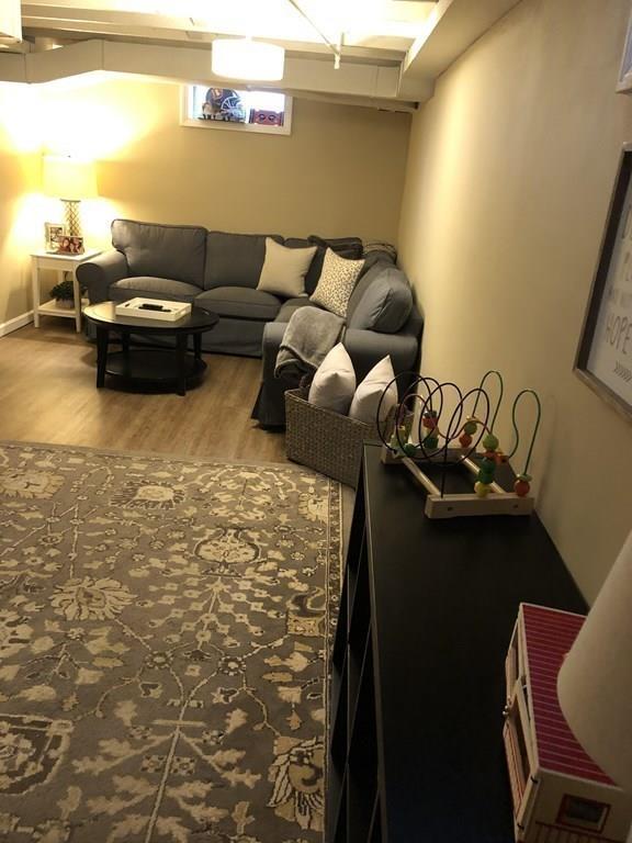 16 Mayfield Street Springfield, MA 01108 - Photo 15 of 20 a living room with furniture and a floor to ceiling window