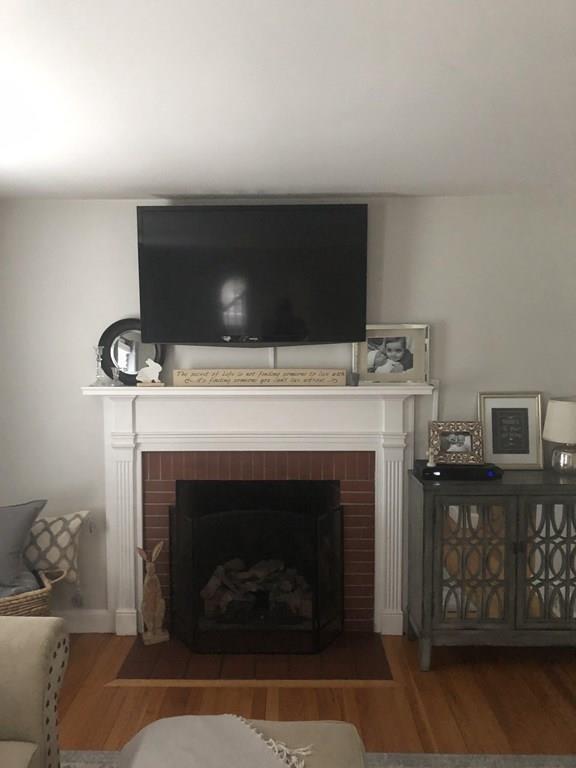 16 Mayfield Street Springfield, MA 01108 - Photo 8 of 20 a living room with furniture and a fireplace